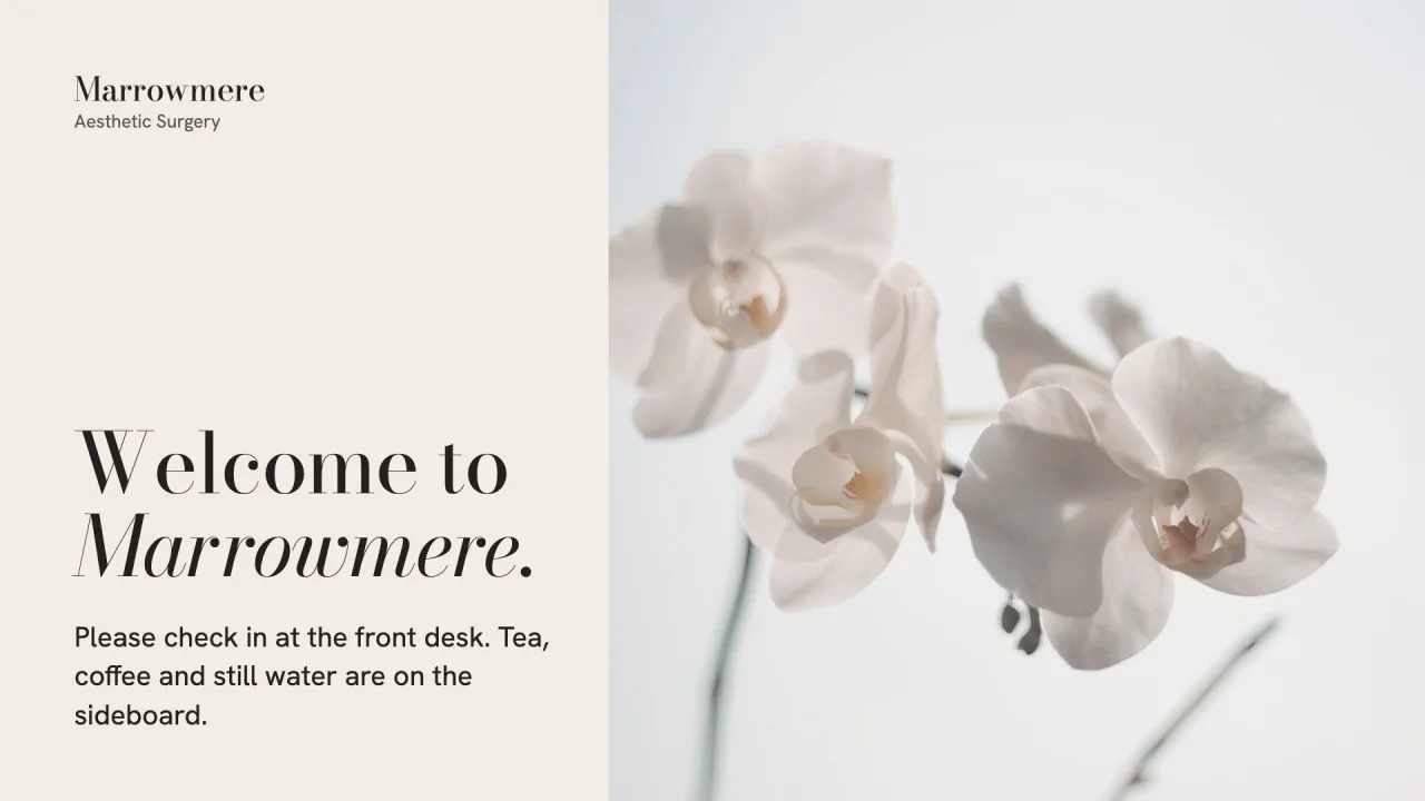Example slide for Marrowmere Aesthetic Surgery. White orchids beside the words welcome to Marrowmere.